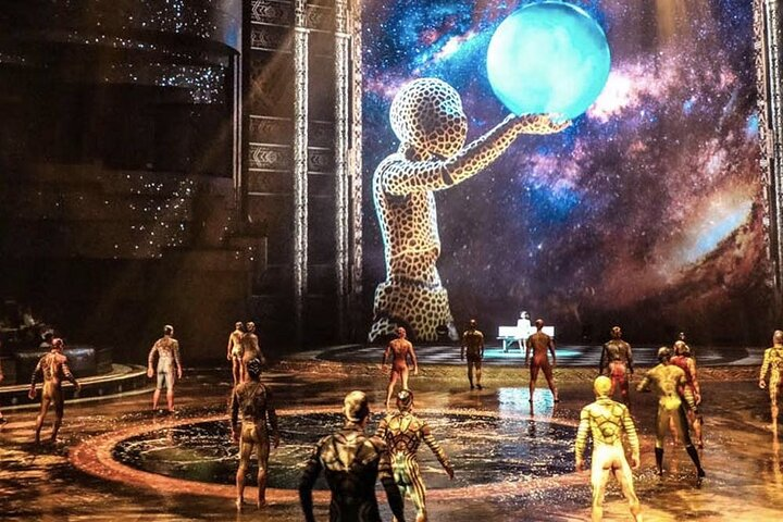 Experience the magic of La Perle where art meets aquatic wonder as performers soar and dive transforming the stage into an unforgettable celebration of creativity and talent.